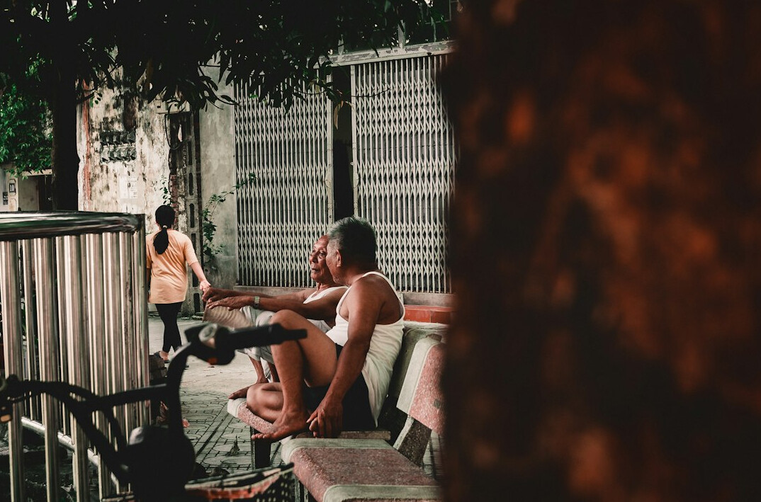 Group of friends having a relaxed conversation around a table